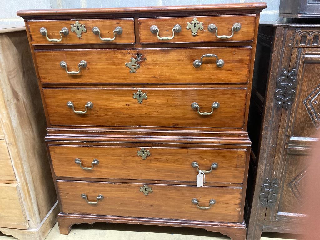 An early 19th century two part fruitwood chest